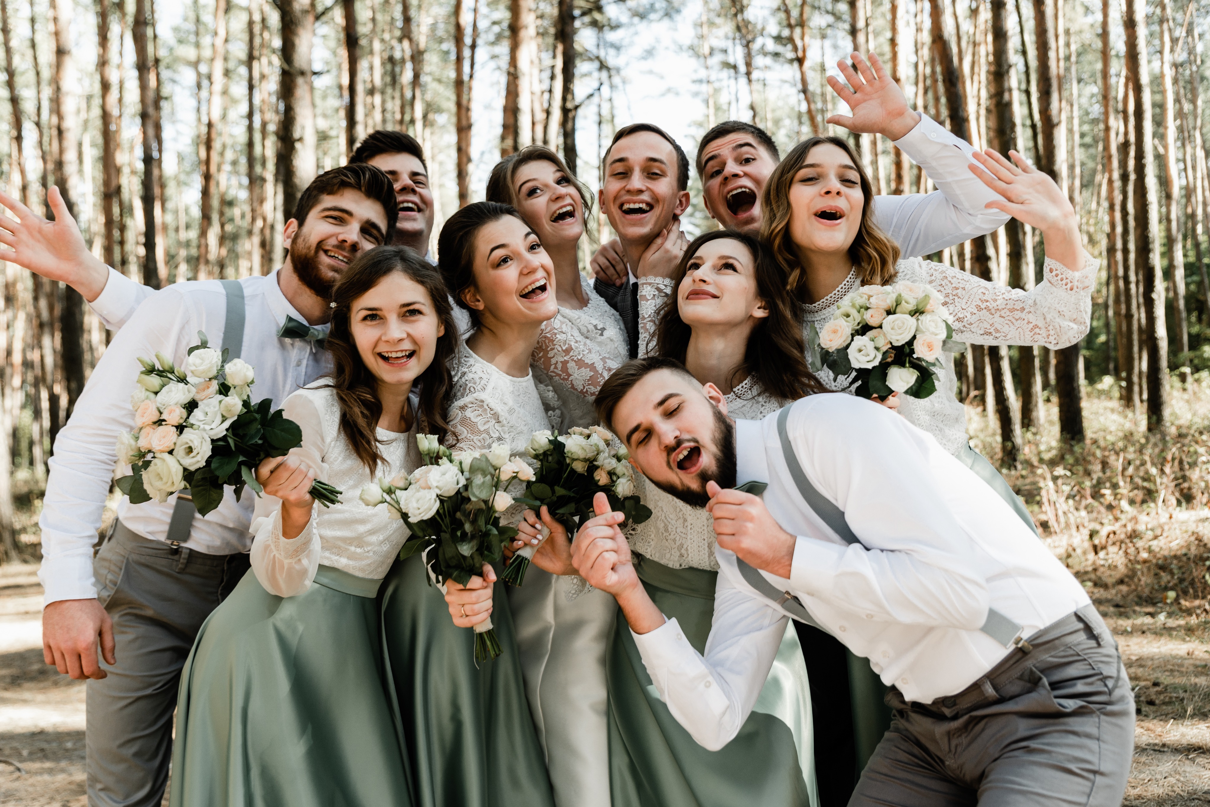 A relaxed, joyful wedding party group portrait