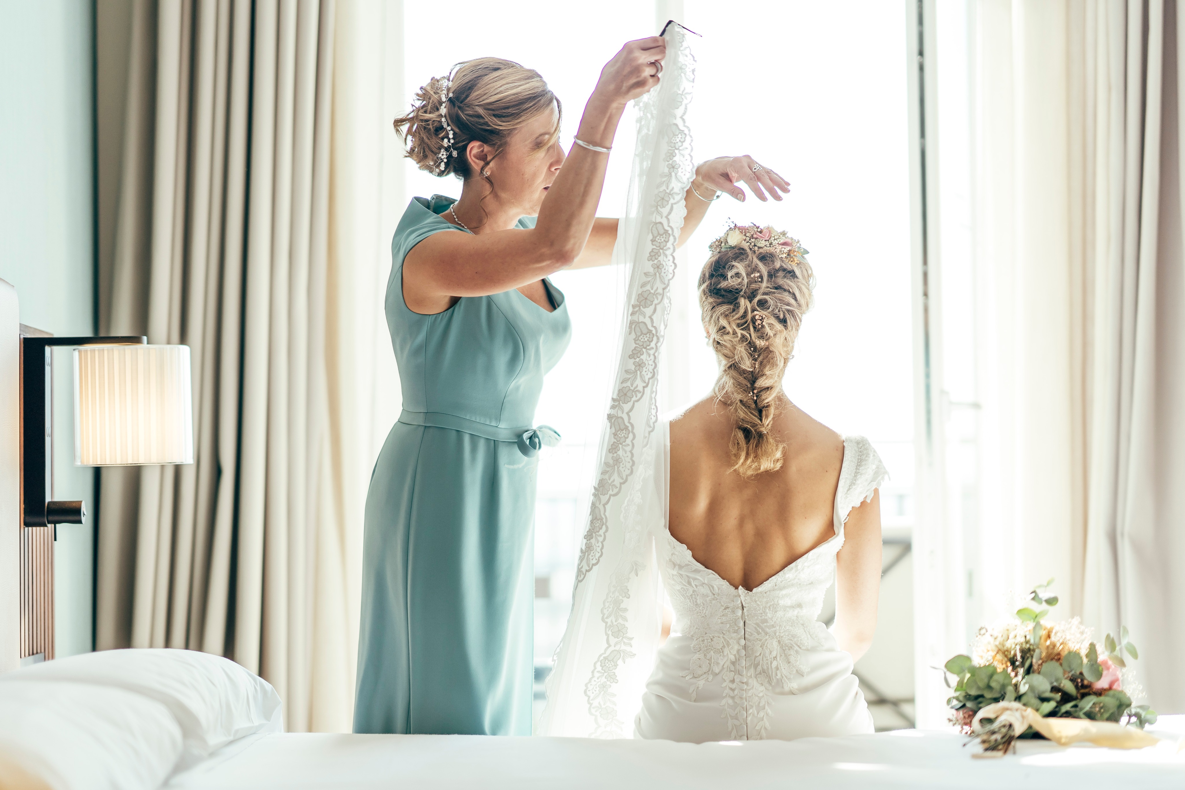 Wedding morning — quiet hands and final details in soft natural light